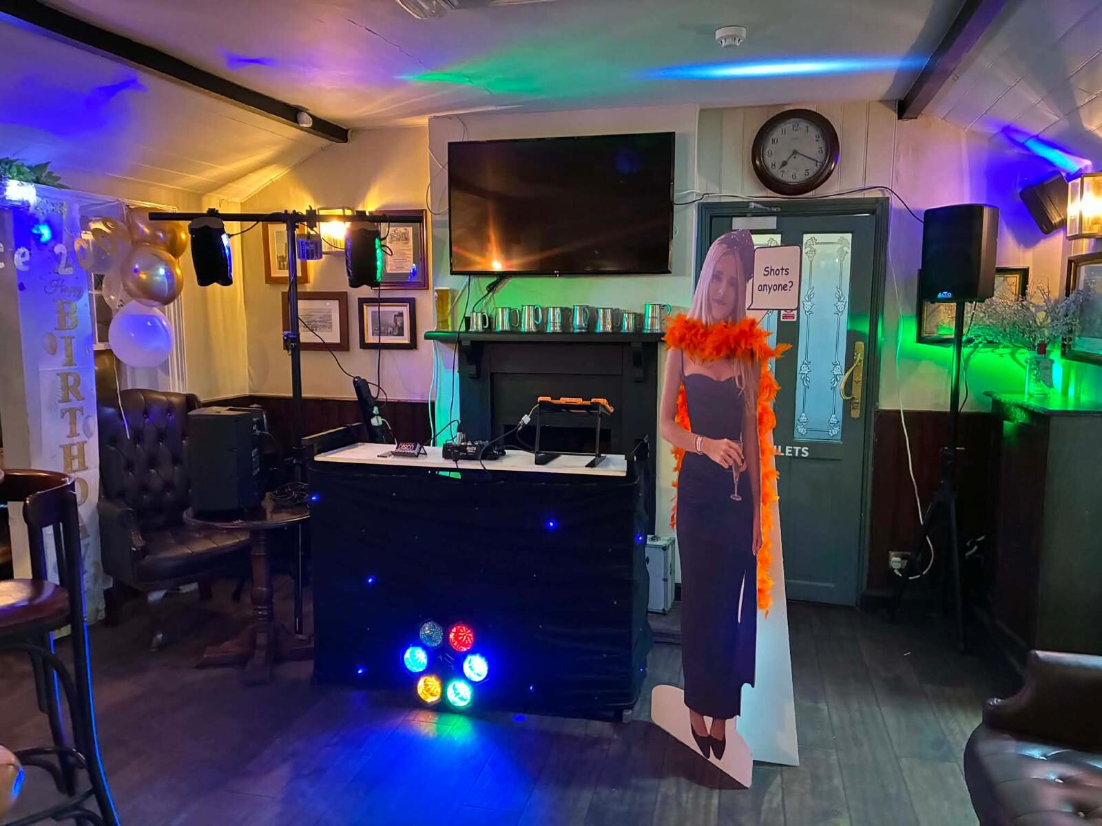 Birthday party disco setup in a pub with lighting and decorations